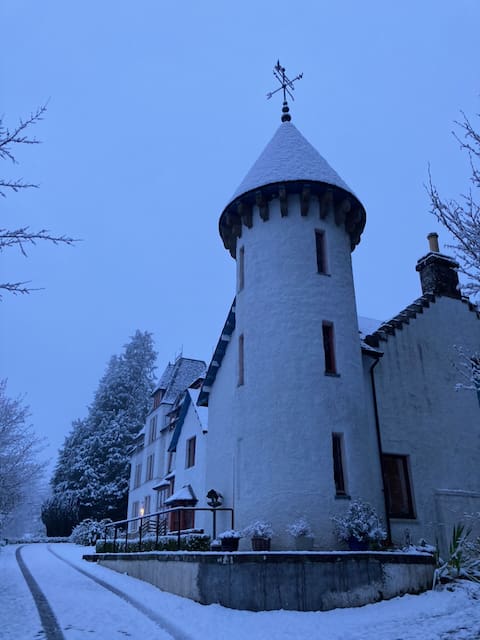 Turreted house in the snow
